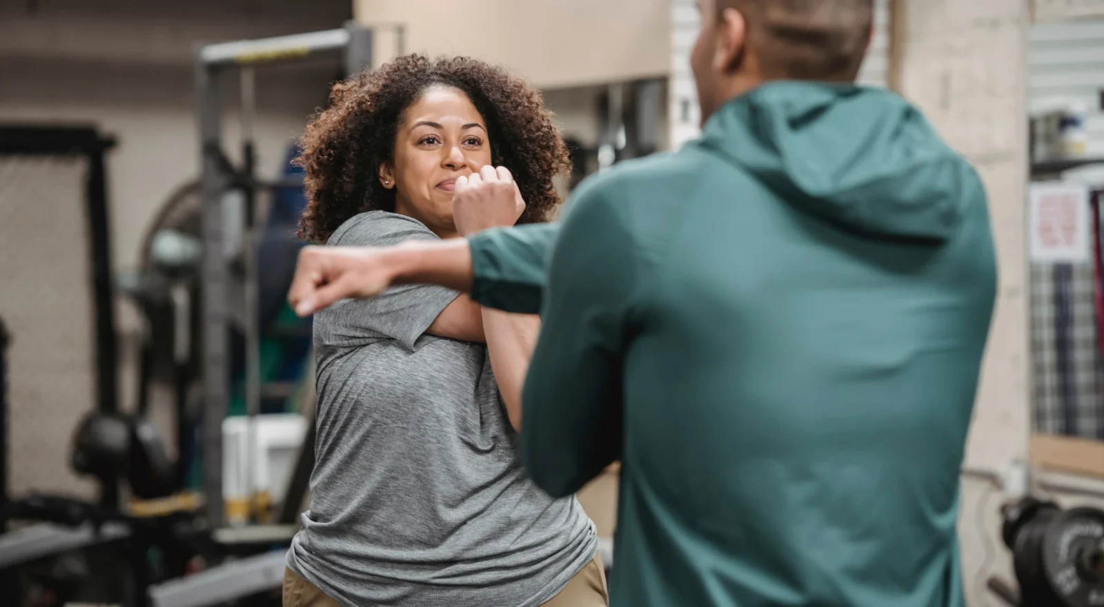 coach with client, stretching.