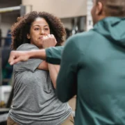 coach with client, stretching.