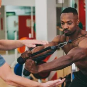 Personal trainer working out with client