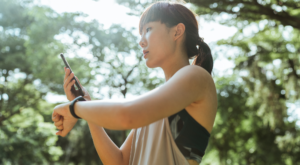 Woman walking and looking at phone