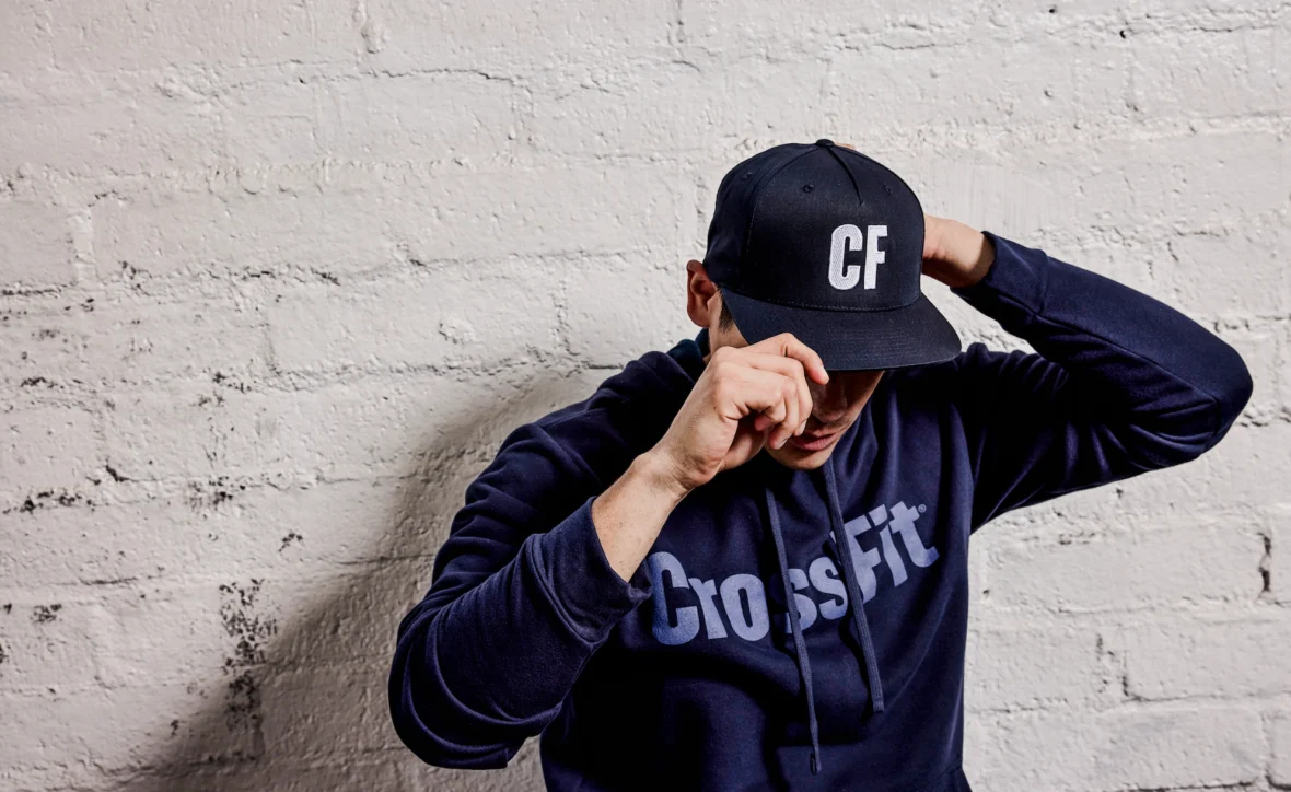 man wears CrossFit hat