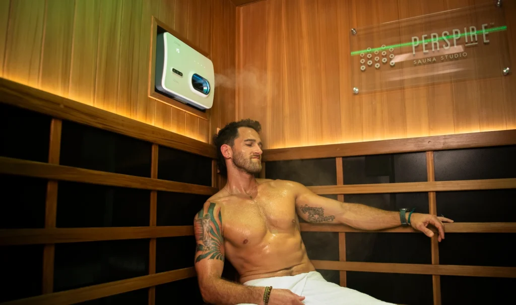 person sitting in sauna