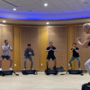 group of people on power plates in a class