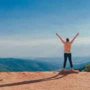 Person outside with happy arms