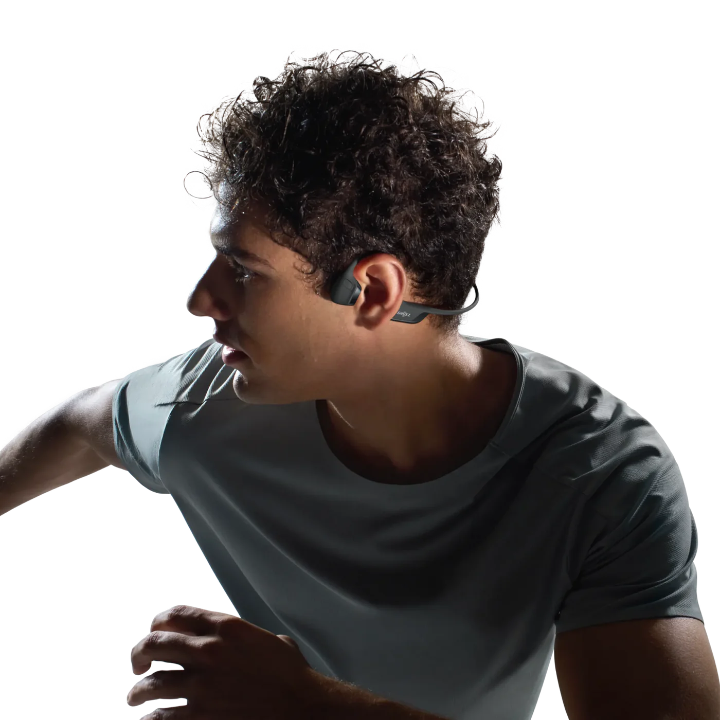 Person wearing Shokz headphones