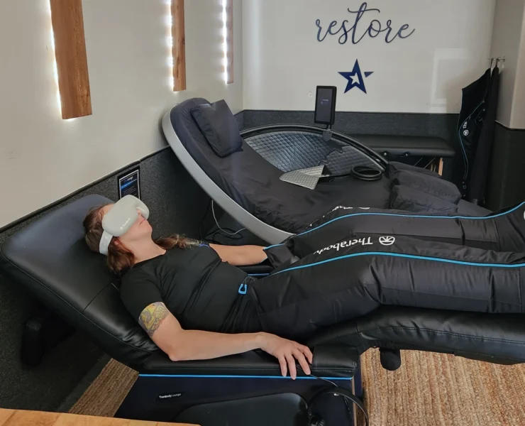 woman in recovery chair at gym