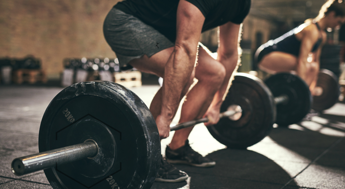 man and woman lighting weights