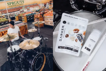 Travis Barker plays drums next to a Barker Wellness product