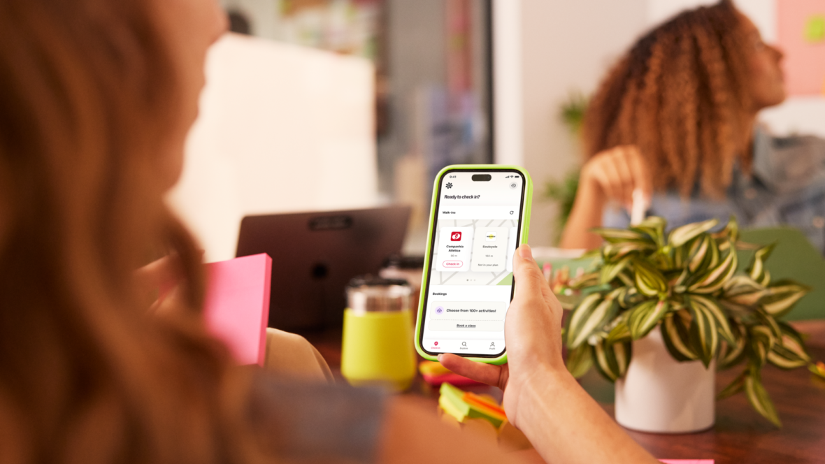 female employee uses Wellhub app