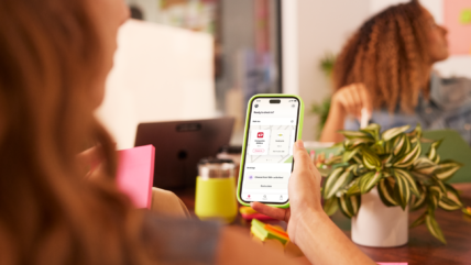 female employee uses Wellhub app