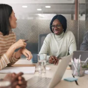 people at work meeting laughing