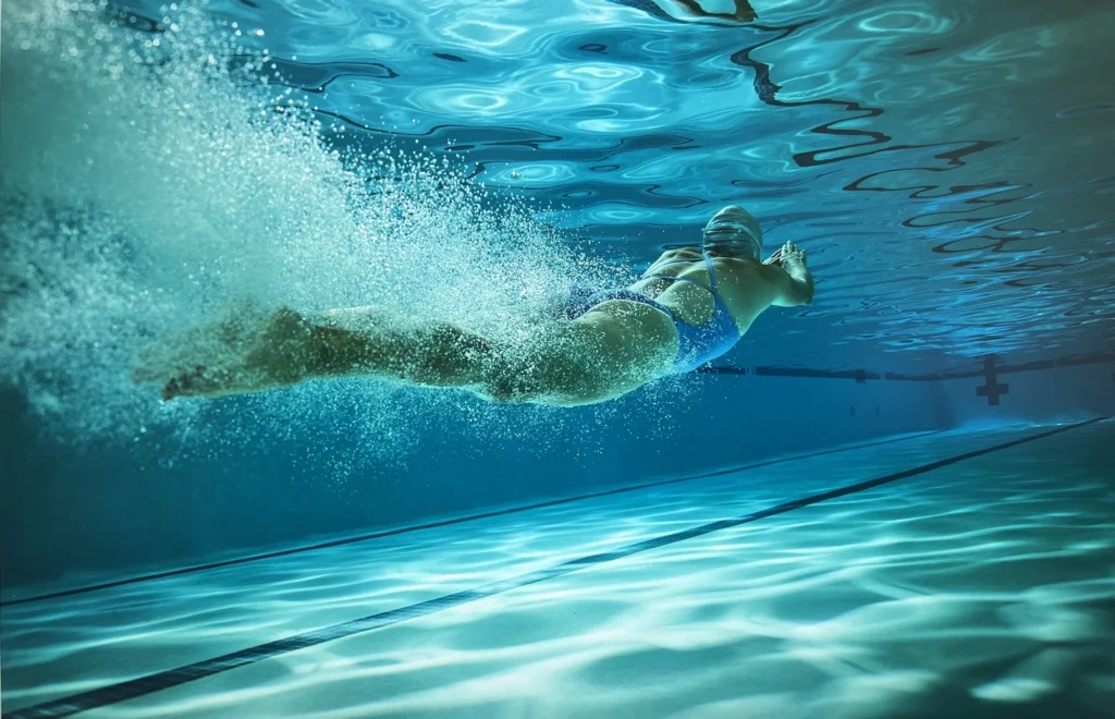 woman swims at a local gym