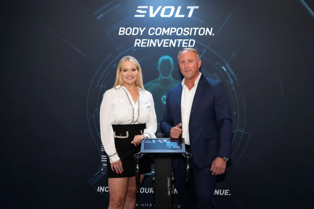 a smiling image of Evolt's co-founders at an event 