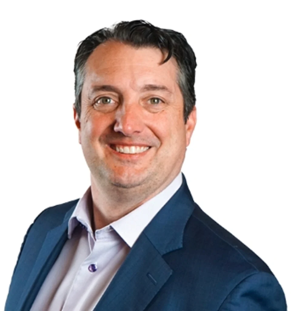 A smiling image of a man in a blue suit against a white background