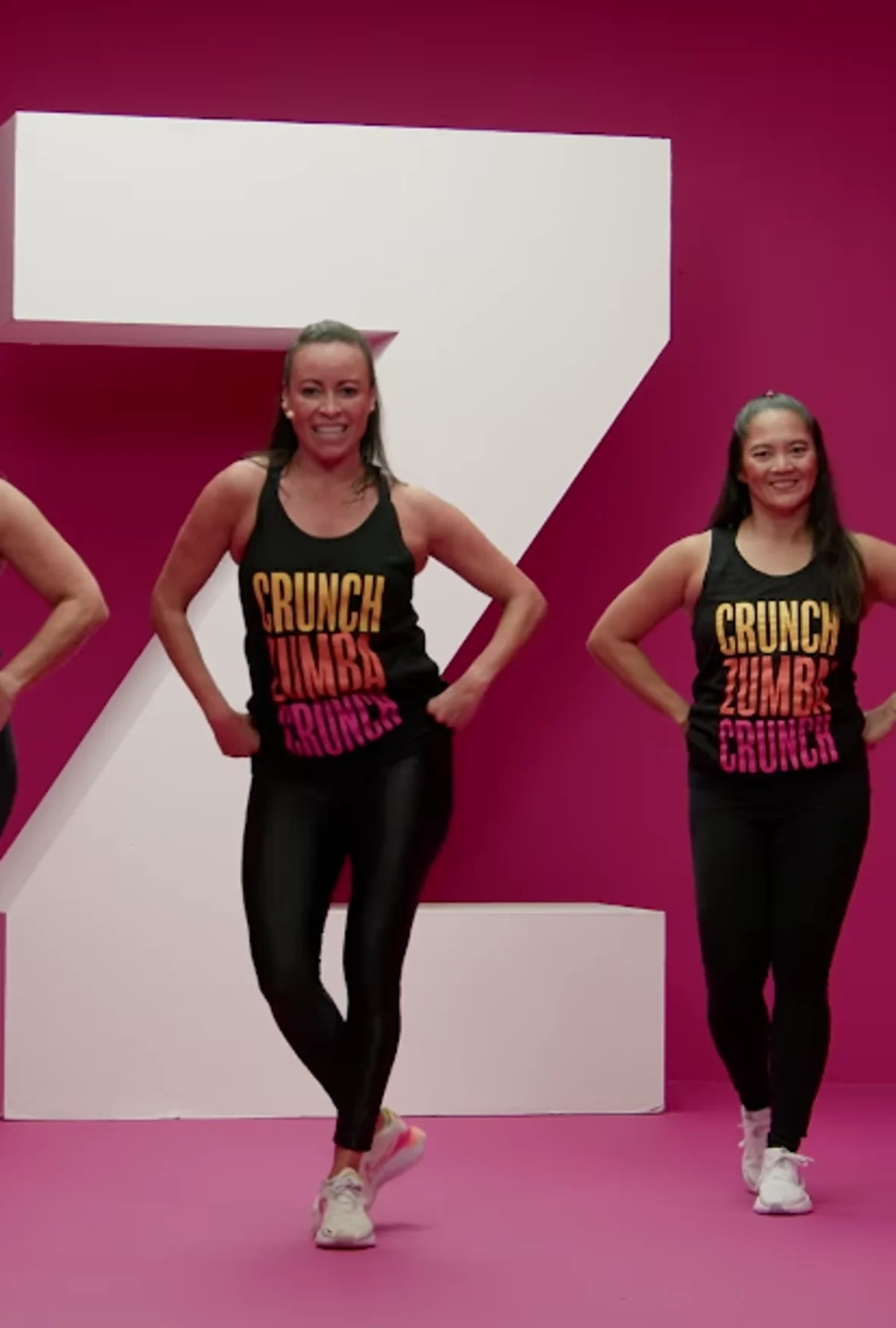 An image depicting Crunch Fitness members participating in Zumba group fitness.