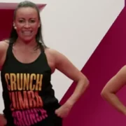 An image depicting Crunch Fitness members participating in Zumba group fitness.