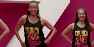 An image depicting Crunch Fitness members participating in Zumba group fitness.