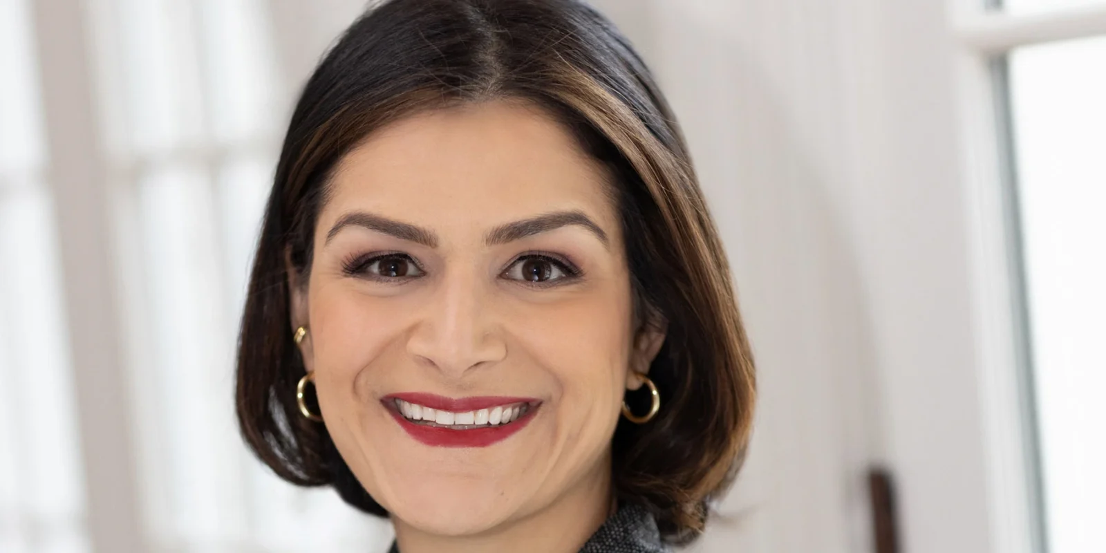 a smiling headshot of Sima Sistani