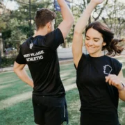 man and woman high five at The Athletic Clubs in West Village