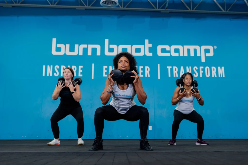 group of women strength-training at gym