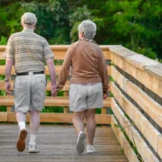 an image of two seniors walking together hand in hand