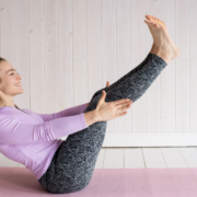 Young woman doing a Pilates teaser