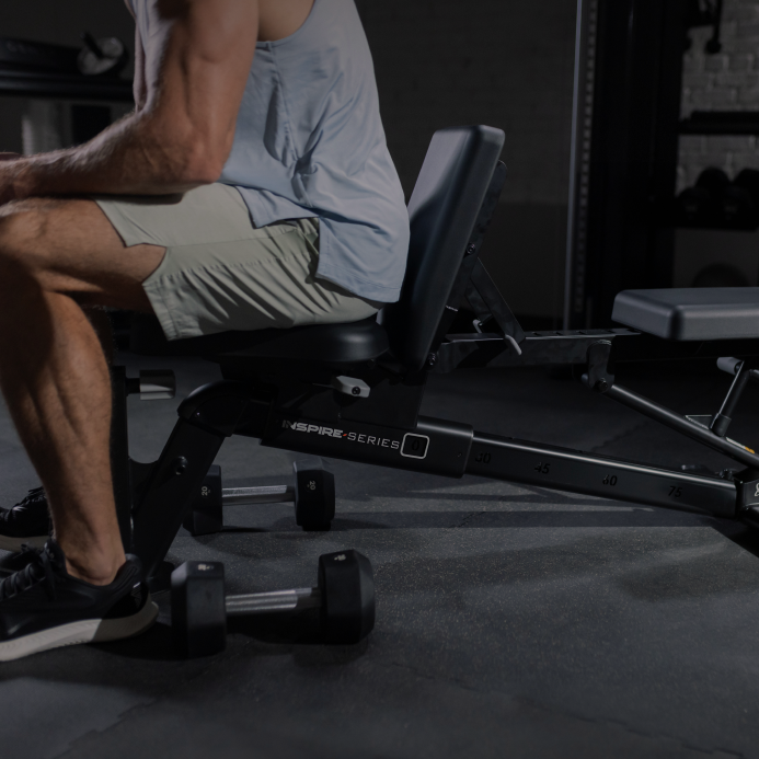 man sits on Centr Inspire bench