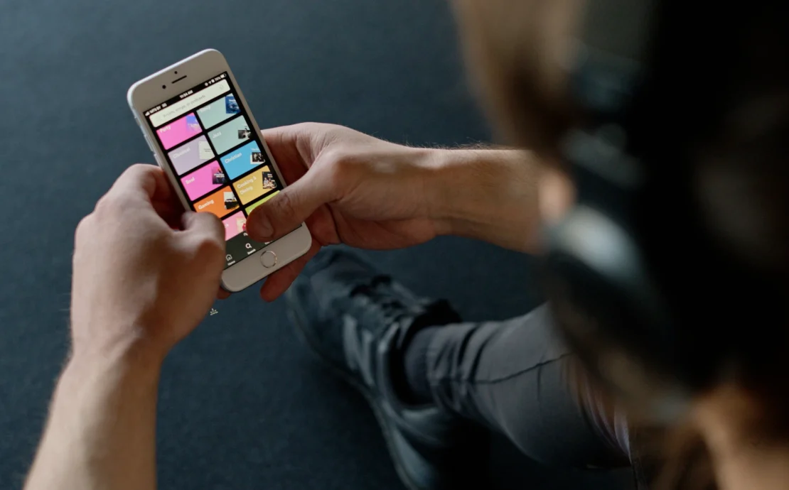 Person at gym looking at phone