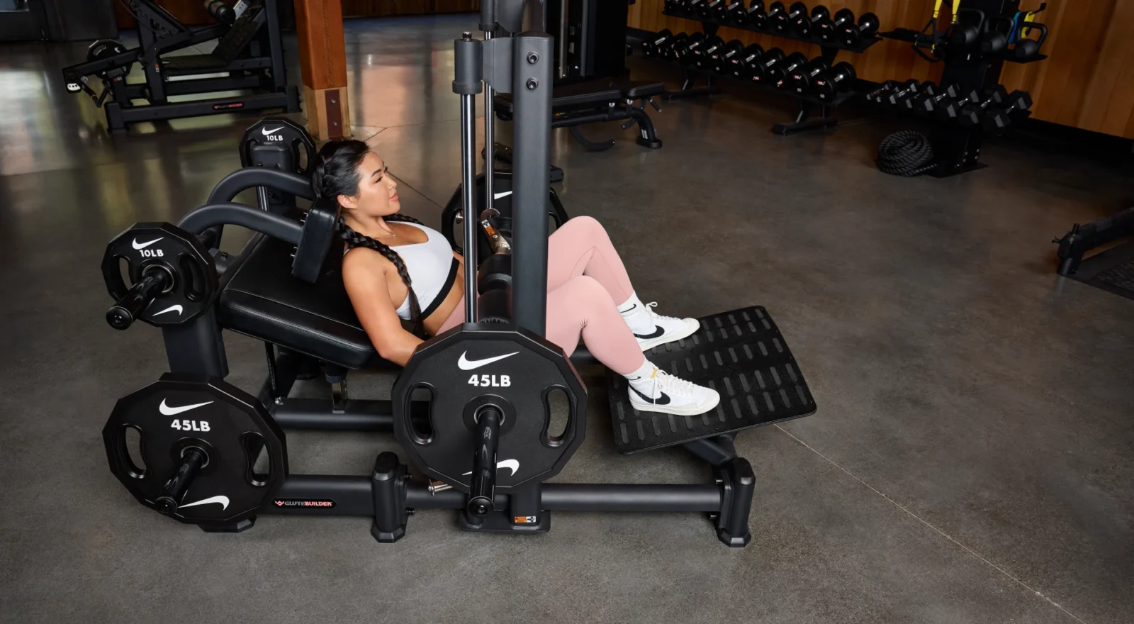 Woman using hip thrust machine