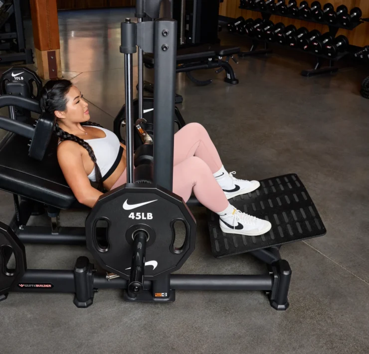 Woman using hip thrust machine