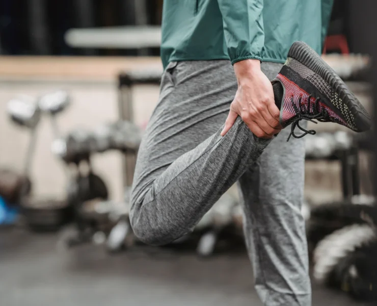 Person stretching at a gym