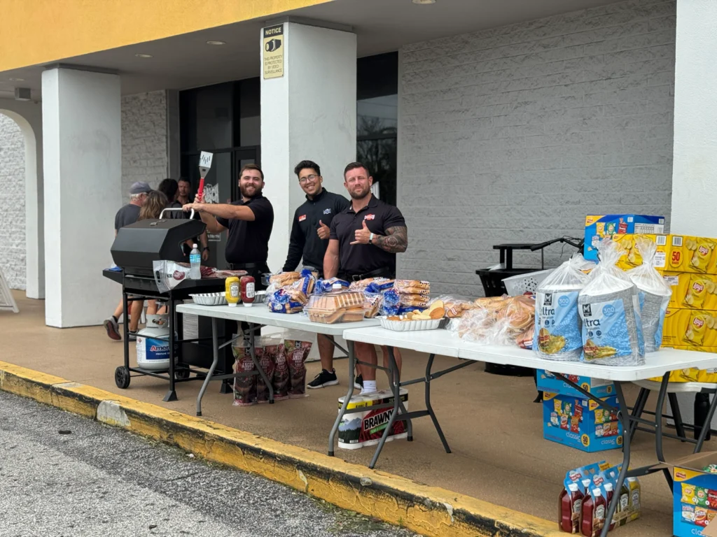 Crunch fitness staff members pass out food in Florida