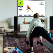 woman working out with F45 at home on a Samsung TV