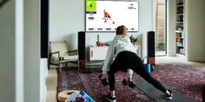 woman working out with F45 at home on a Samsung TV