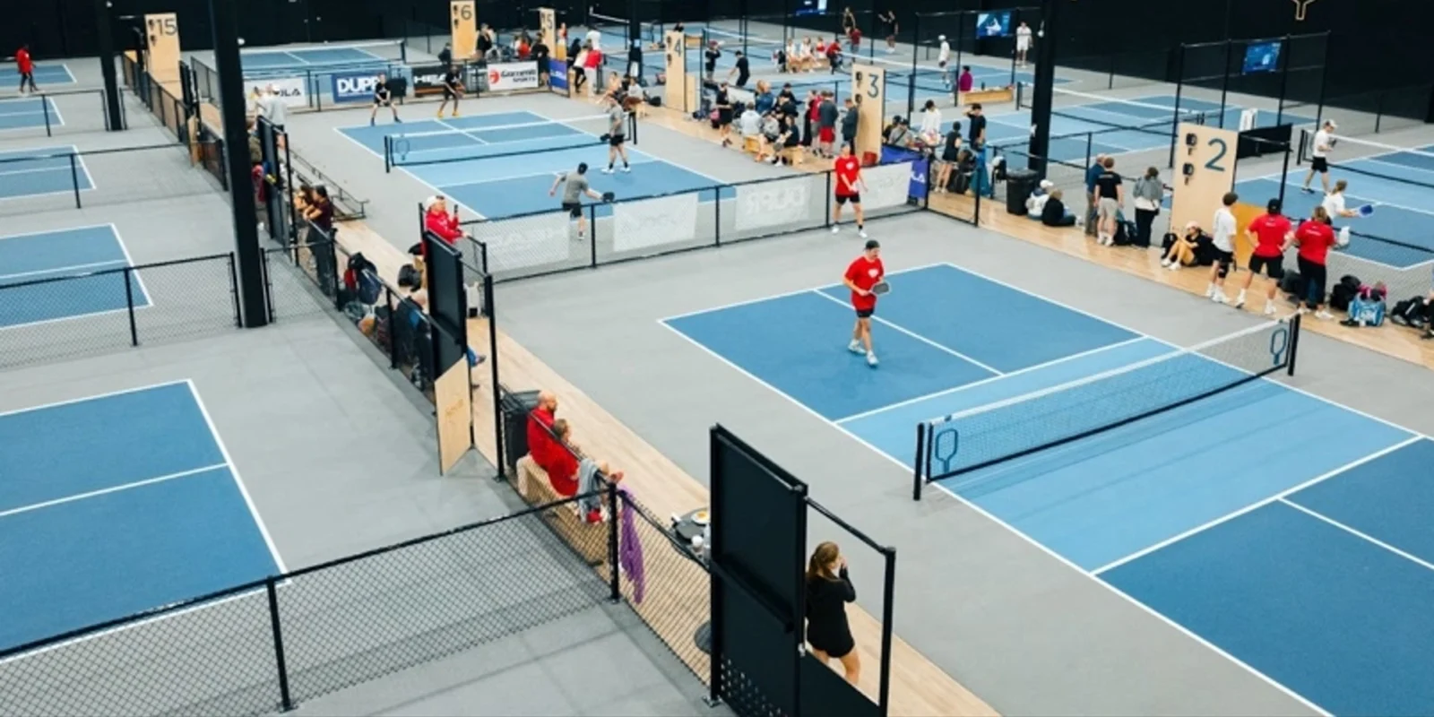 an indoor pickleball court (The Picklr)