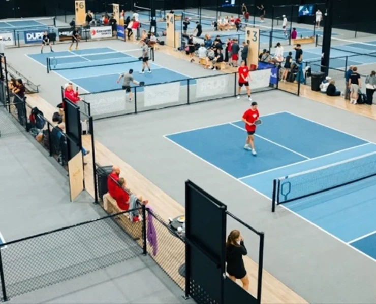 an indoor pickleball court (The Picklr)