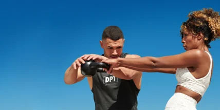 an image of a fitness trainer and a client outside