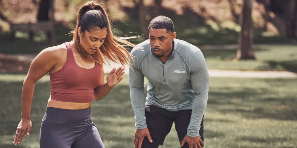 a personal trainer and a client outside