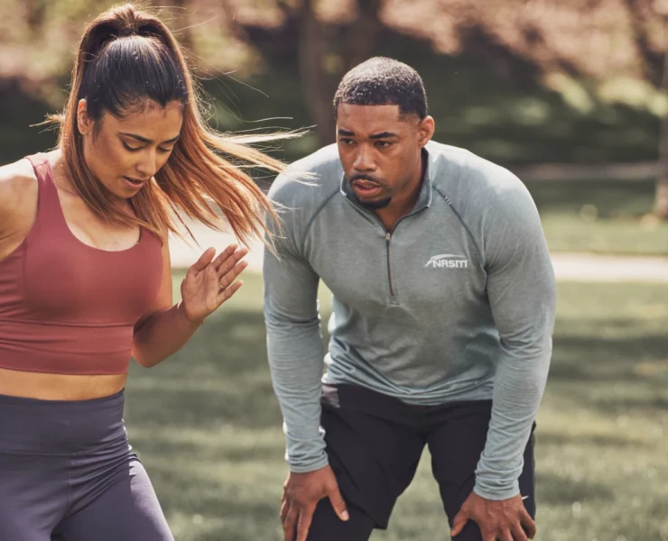 a personal trainer and a client outside