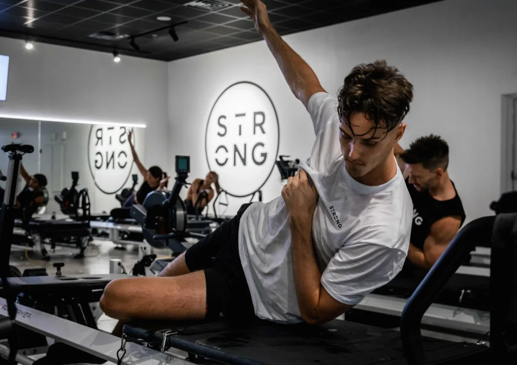 NBA Spurs player Zach Collins tries Strong Pilates 