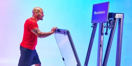 an image of a man in a red t shirt folding the new Echelon Strength Home