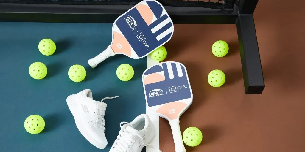 an image of pickleball paddles, balls and sneakers