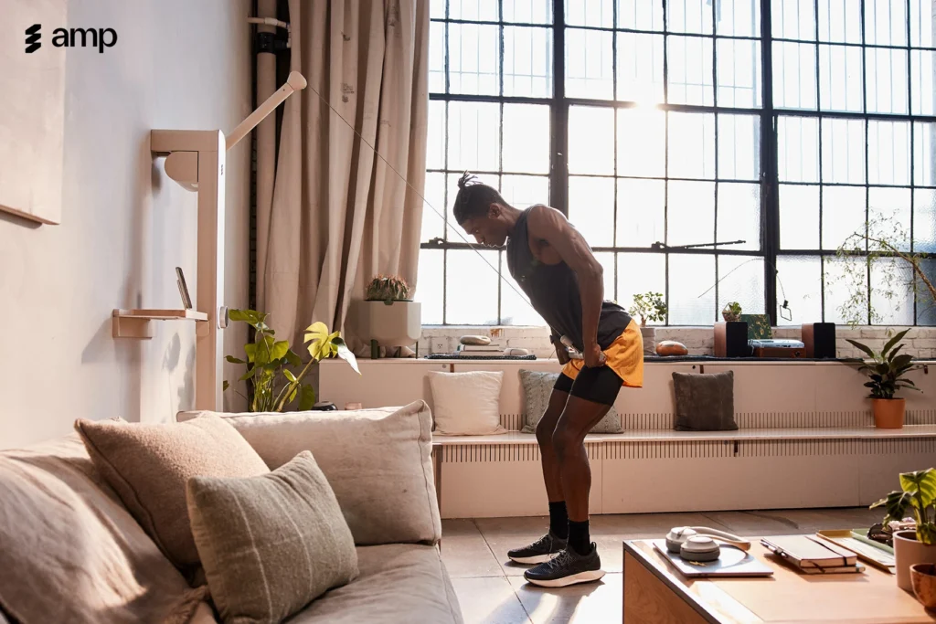 an image of a man working out with the Amp at-home fitness gym