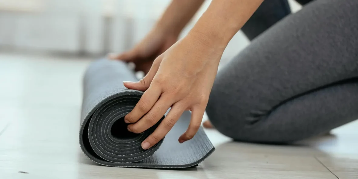 woman with a yoga mat