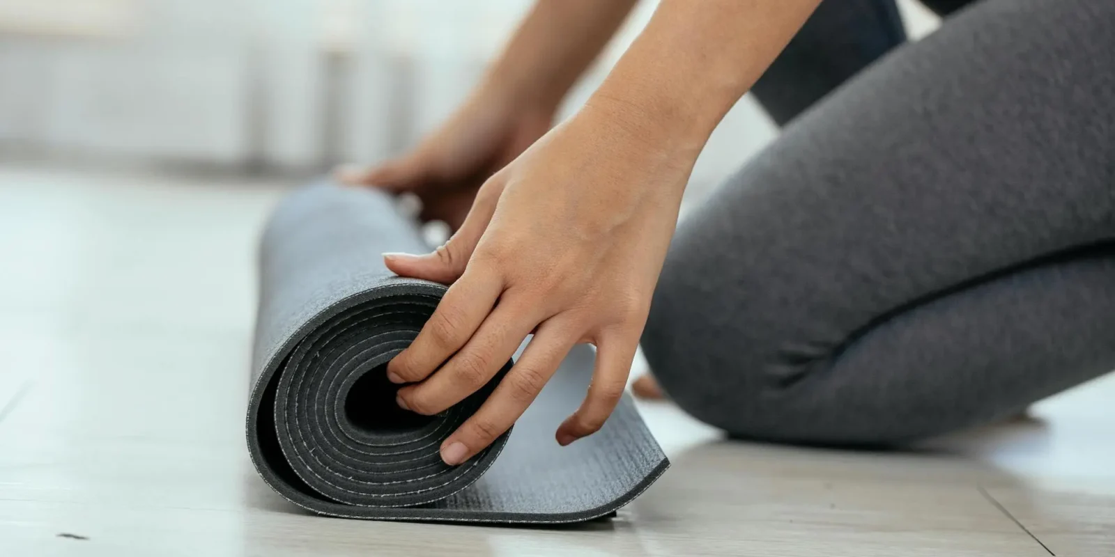 woman with a yoga mat