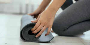 woman with a yoga mat