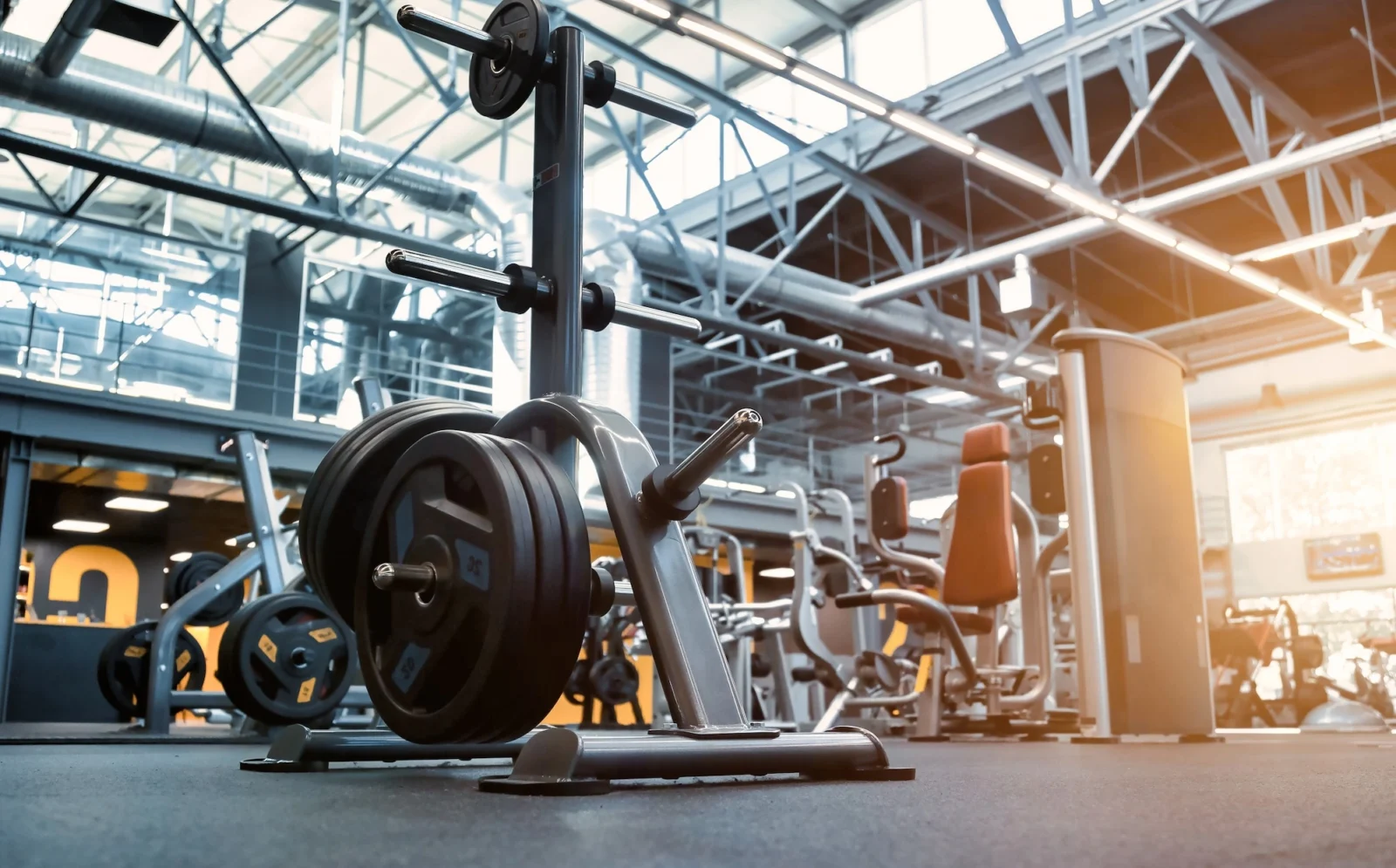 weight stack on the floor of a large gym