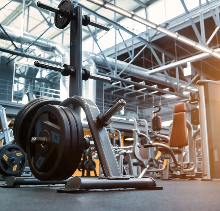 weight stack on the floor of a large gym