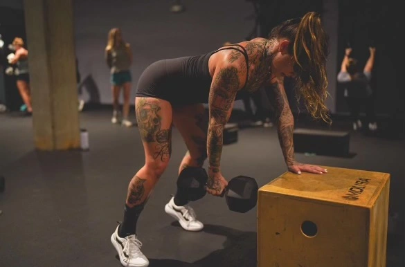 a woman working out at MADabolic Asheville