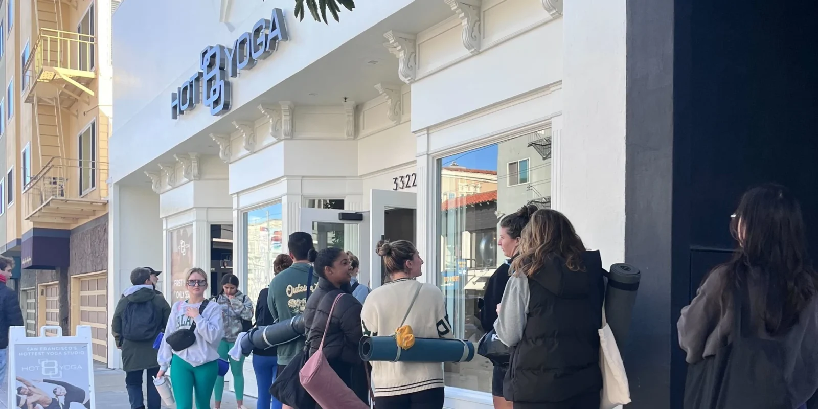 a line outside Hot 8 Yoga's new location in San Francisco